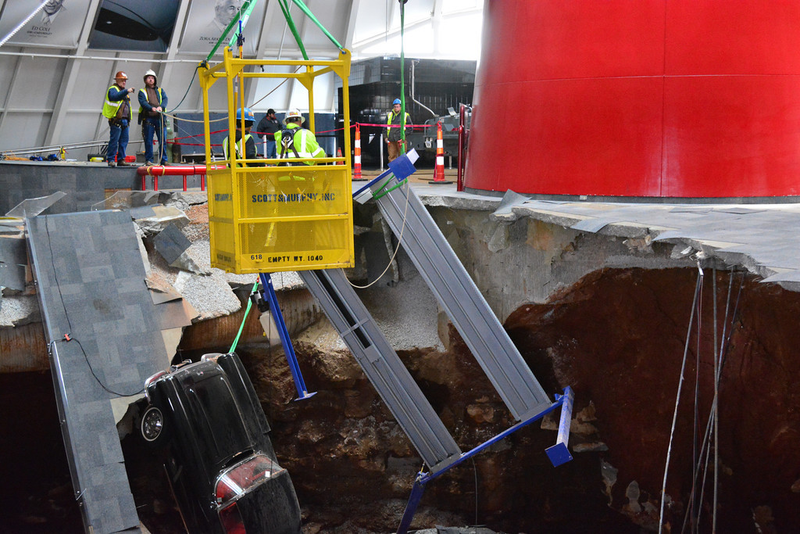 Illustration for article titled Check Out These Amazing Photos From The Corvette Sinkhole Recovery
